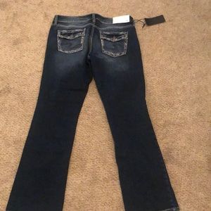 Mid rise dark wash suki silver jeans